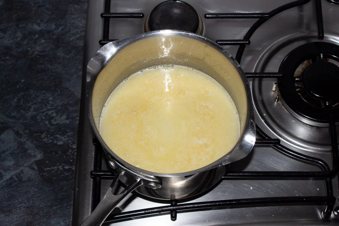 Sugar, lemon juice, water, cornflour and gelatine in a saucepan on a hob