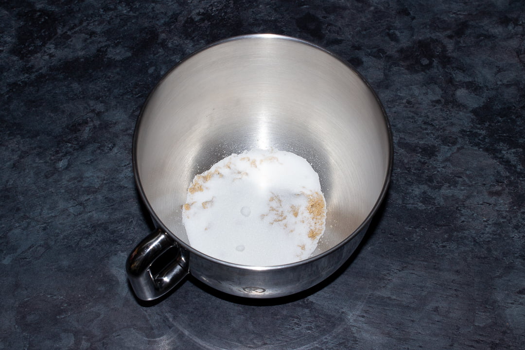 Soft light brown sugar and caster sugar in the bowl of an electric stand mixer