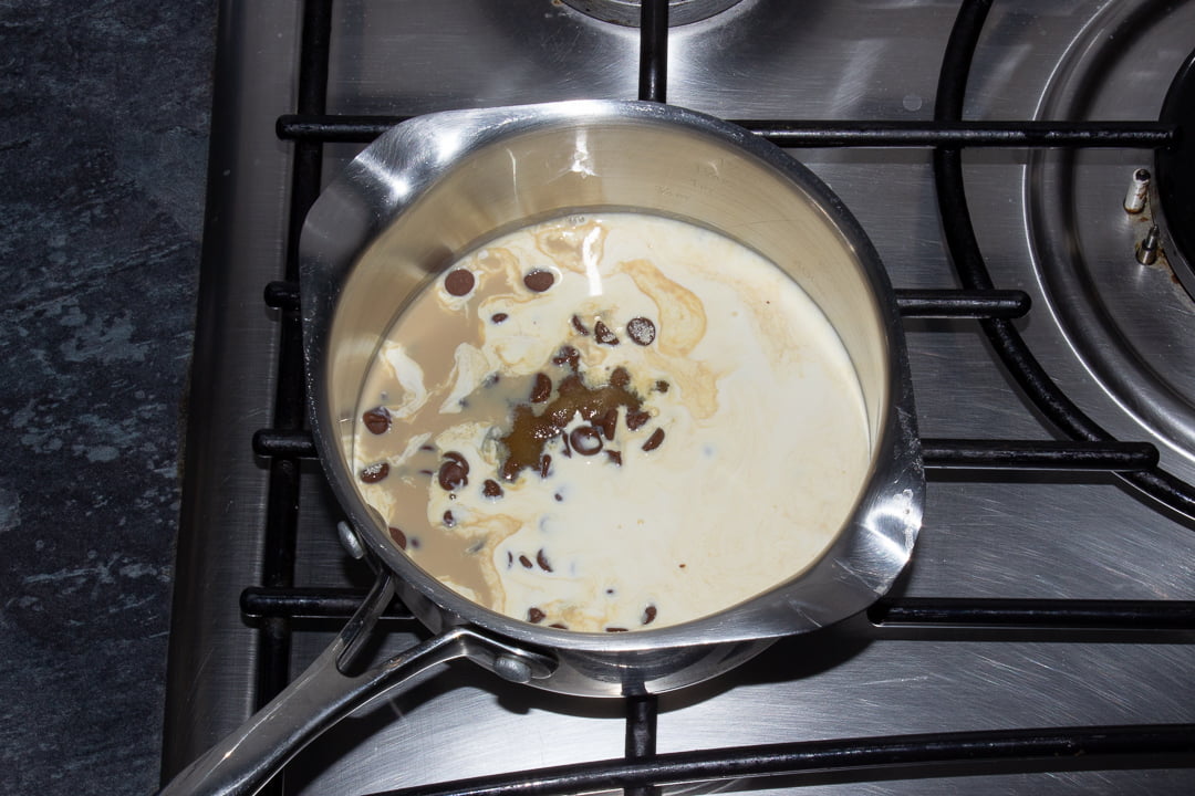 Milk chocolate chips, Baileys, double cream and sugar in a saucepan over a low heat