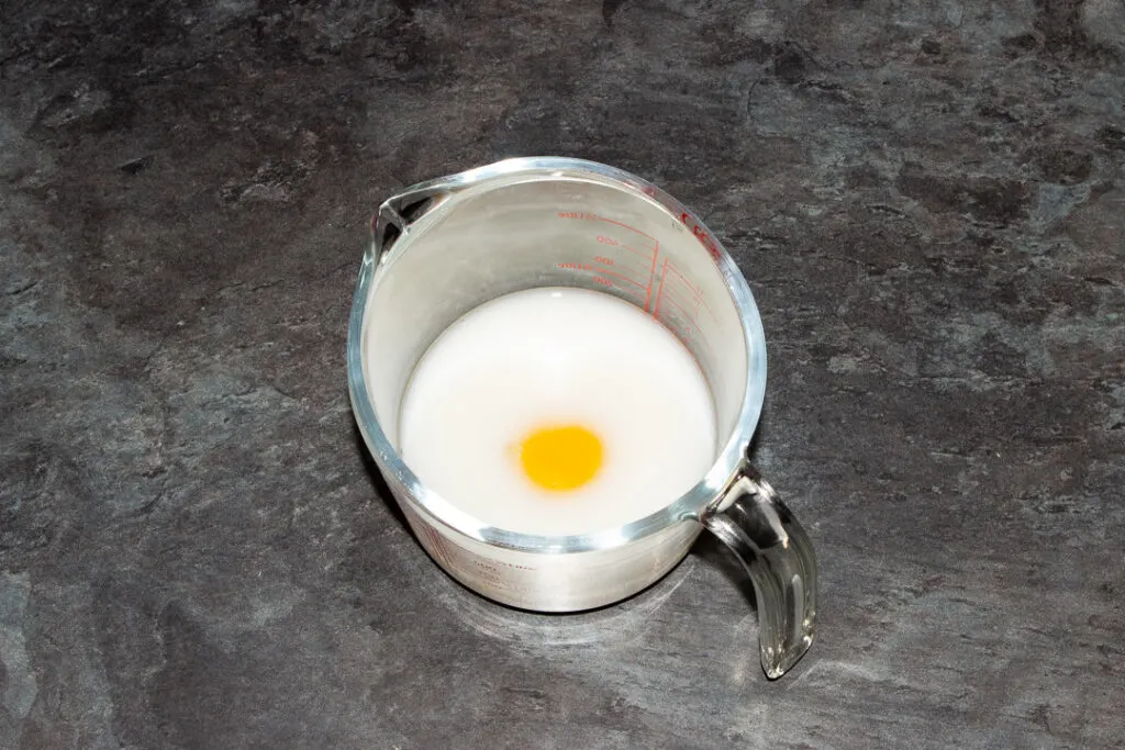 Egg, milk and water in a glass jug