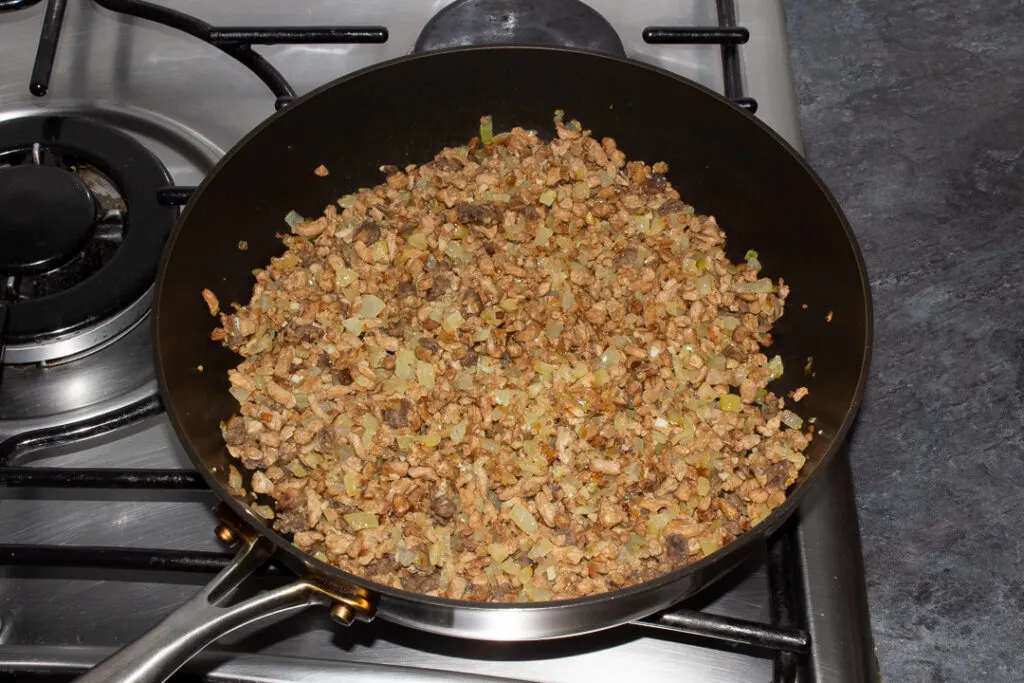 Cooked onion, garlic and soya mince in a frying pan