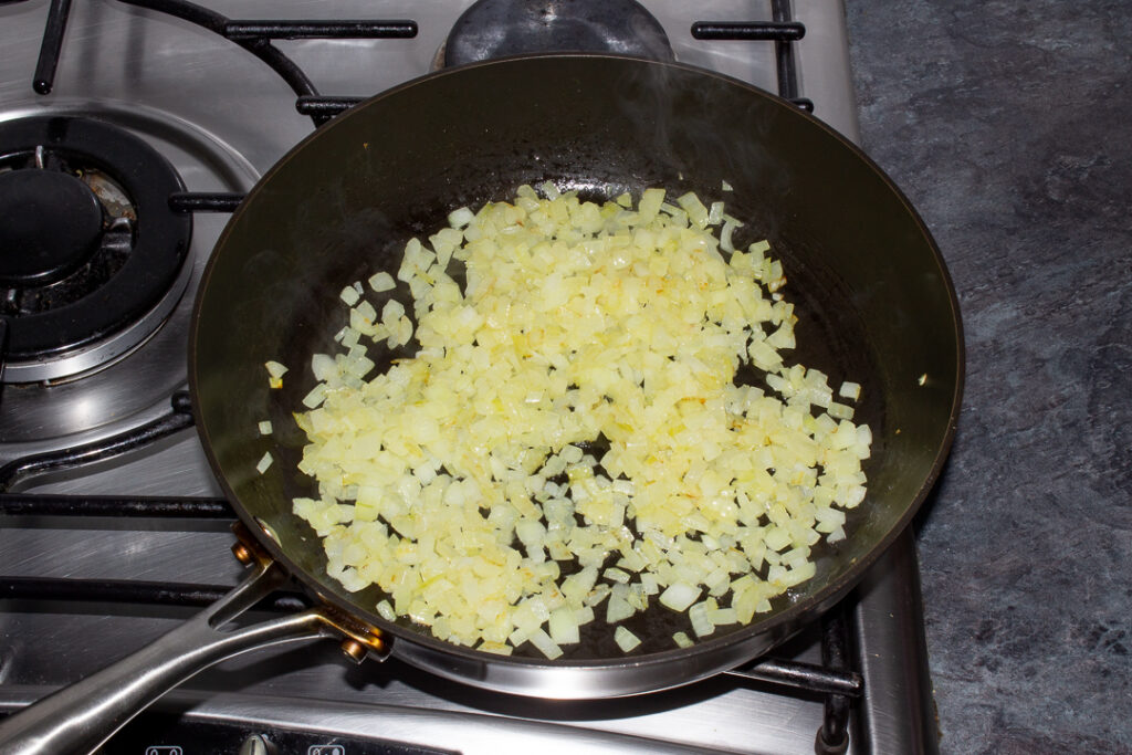 Cooked onion in a frying pan