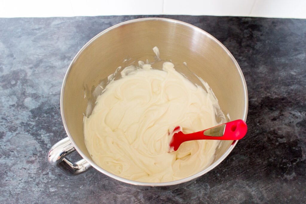 Cream cheese, sugar and vanilla beaten together in a bowl with a spatula