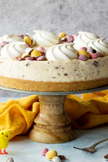 A Mini Egg cheesecake on a cake stand
