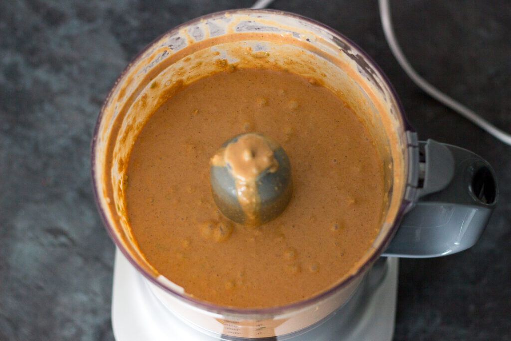 Slow cooker chicken curry sauce in a food processor.