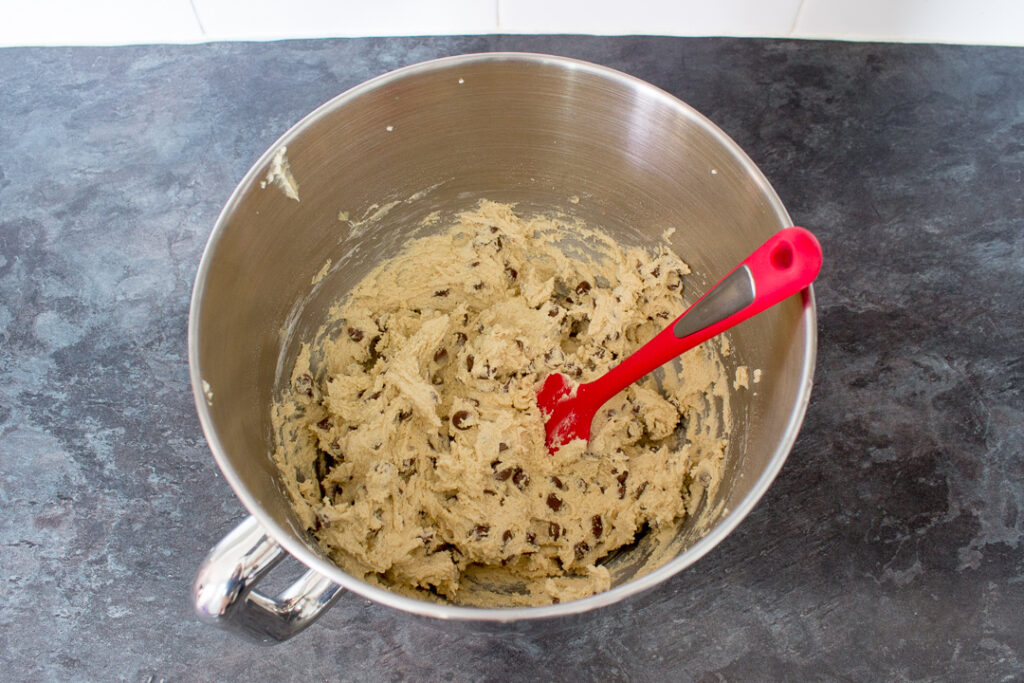 Nutella lava cookie dough in the bowl of an electric stand mixer on a kitchen worktop.