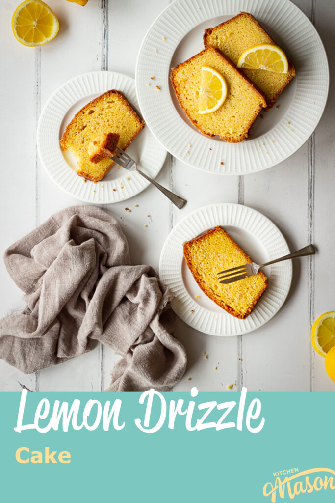 3 White plates topped with slices of moist lemon drizzle cake in a triangle shape. There are also lemon slices, squeezed lemon halves and a light brown linen napkin in the background and it's all set on a white painted wood effect backdrop.