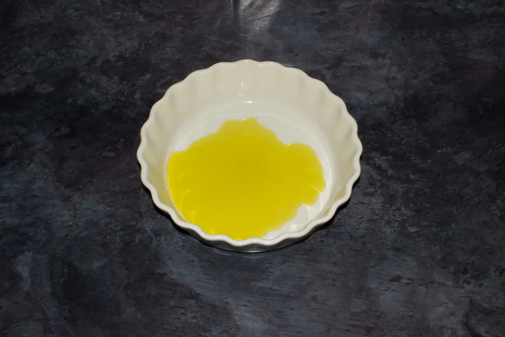 Olive oil poured in an oven proof dish
