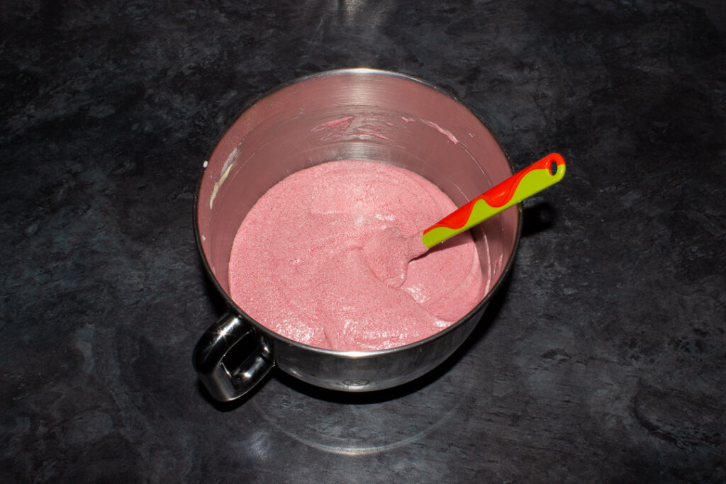 Strawberry cake batter in a stand mixer
