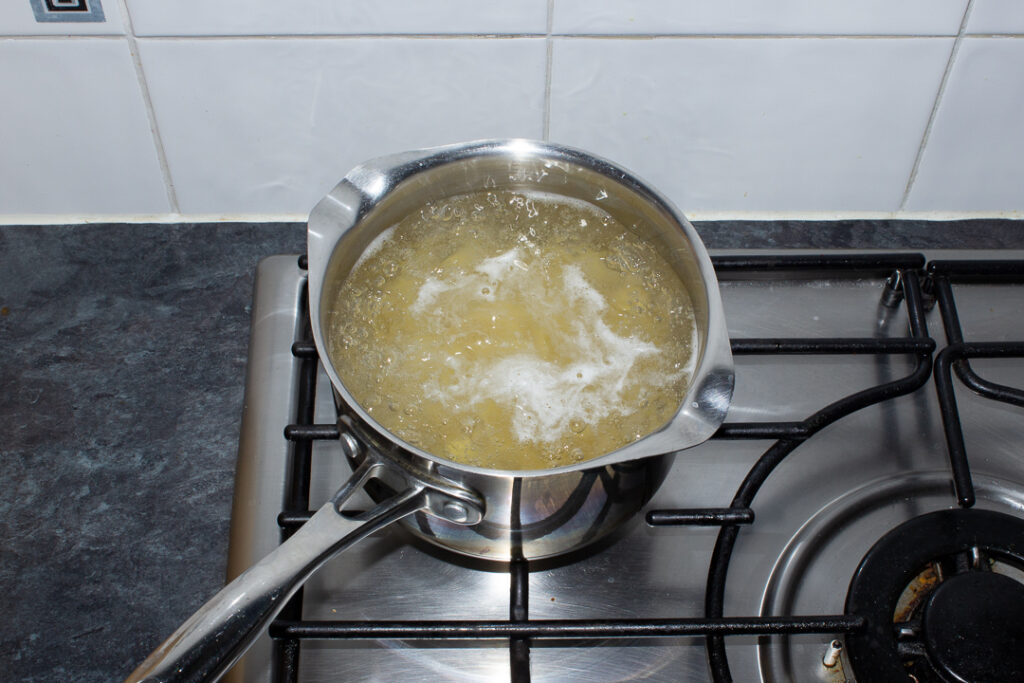 Pasta simmering in a saucepan on the stove