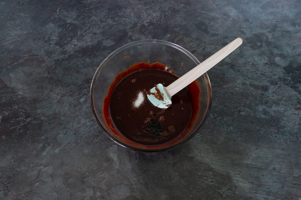 Chocolate brownie ingredients in a glass bowl