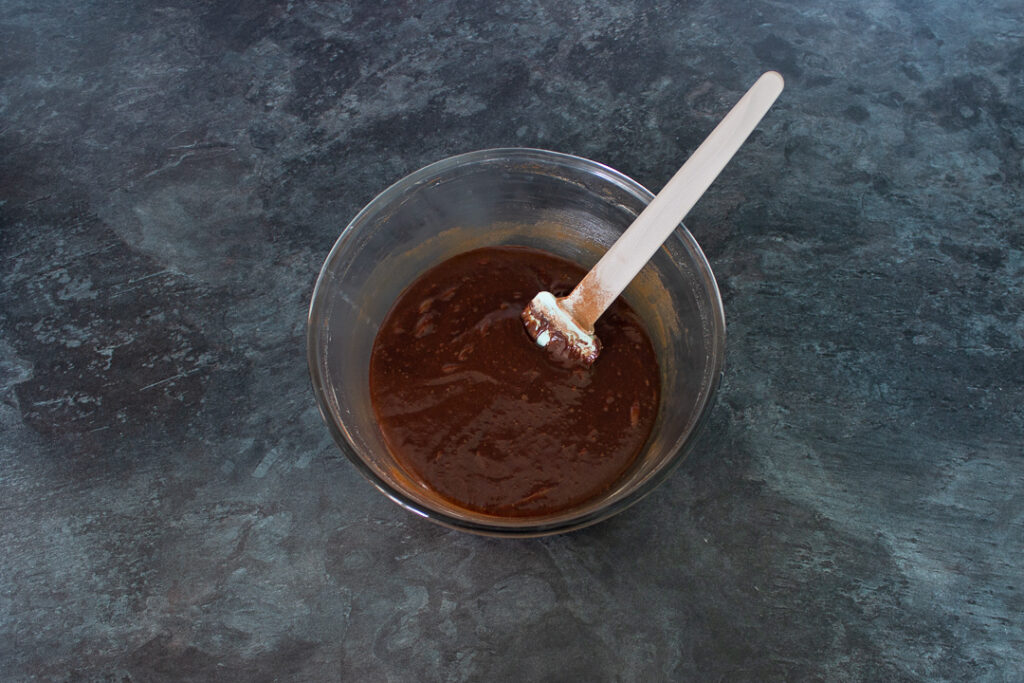 Chocolate brownie batter in a mixing bowl