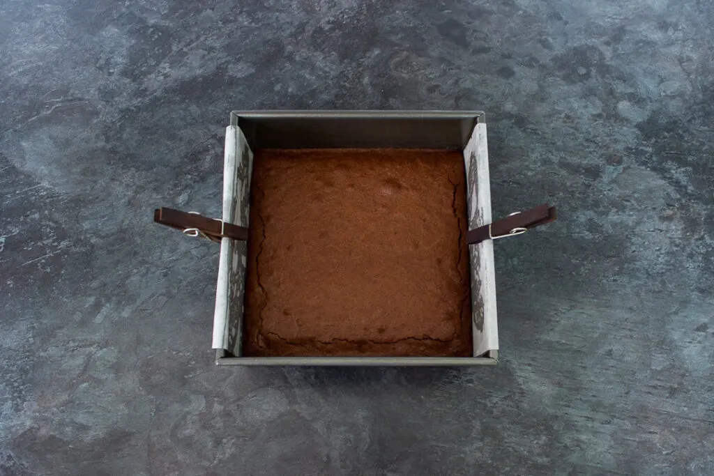 Baked chocolate brownie in a square tin
