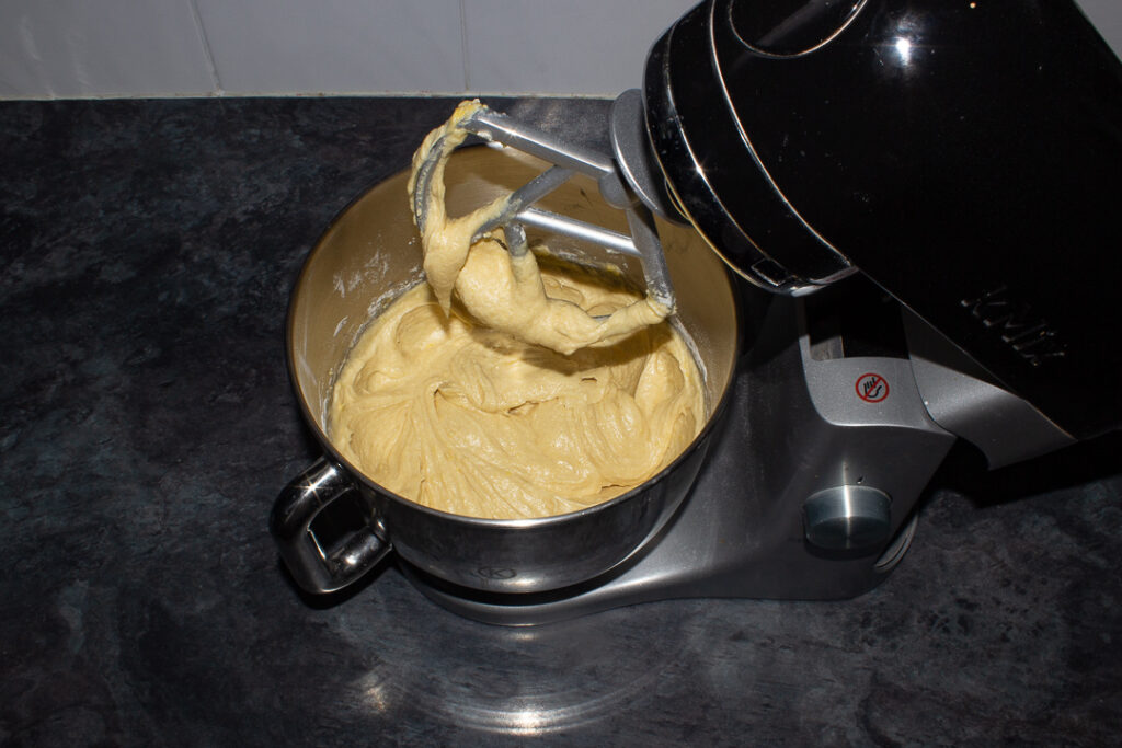 Cake batter in an electric stand mixer.