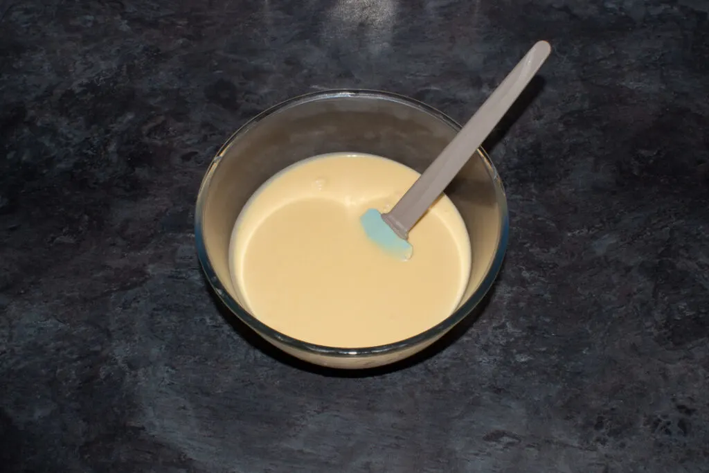 Chilled lemon ice cream mixture in a large bowl