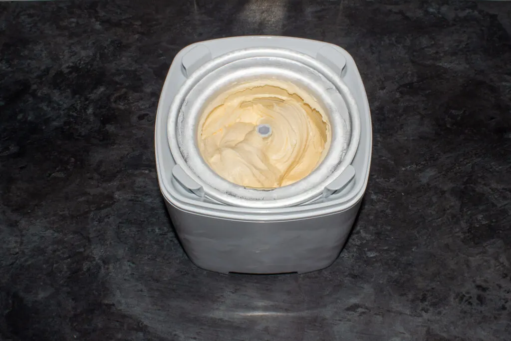 Churned lemon ice cream in a churner