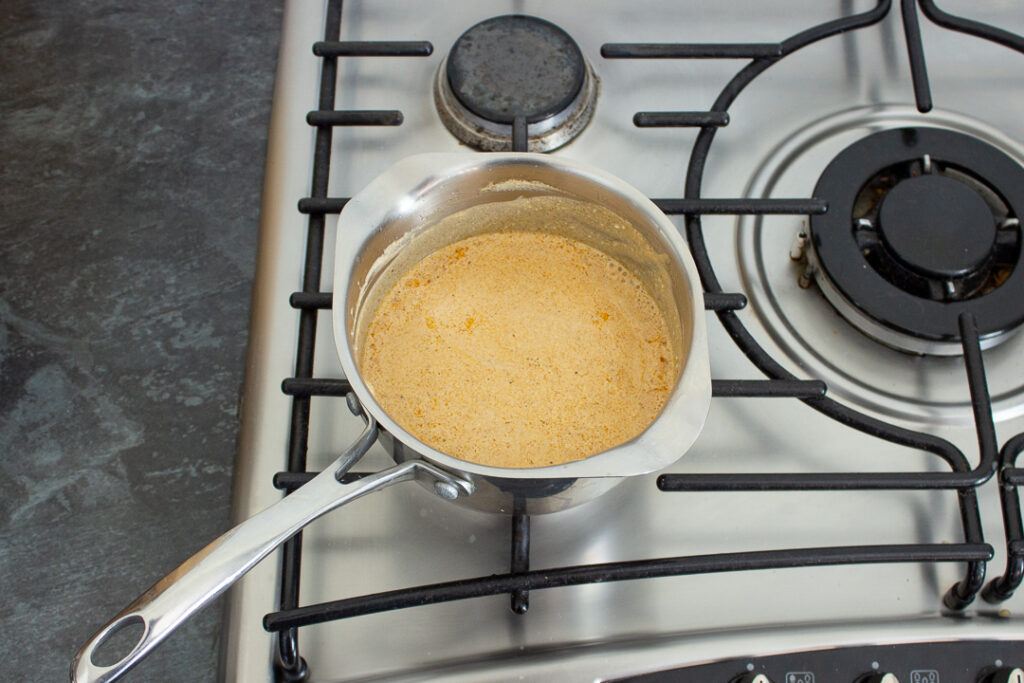 Soured cream pasta sauce in a saucepan