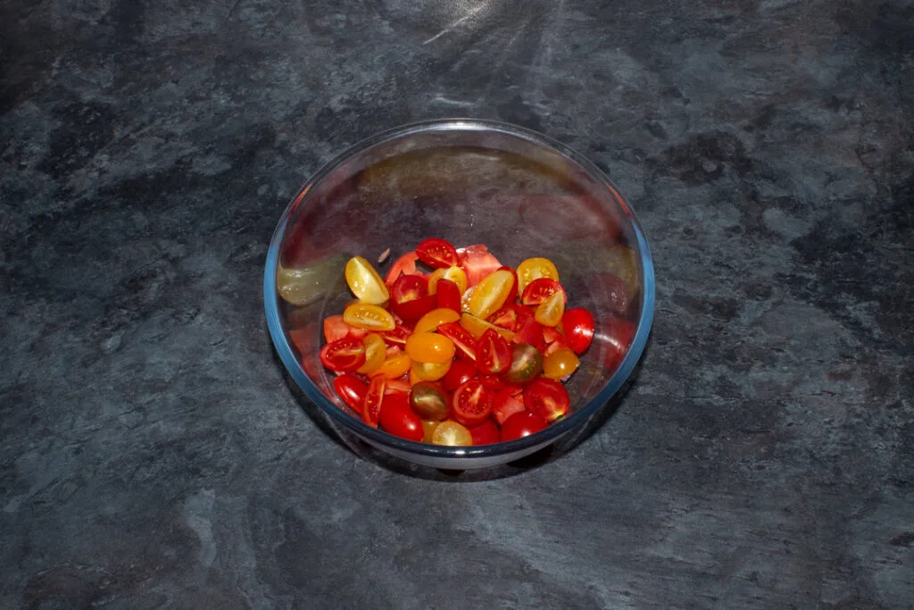 Sliced tomatoes in a mixing bowl