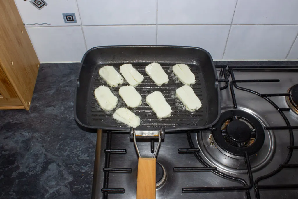 Halloumi bring fried on a griddle pan