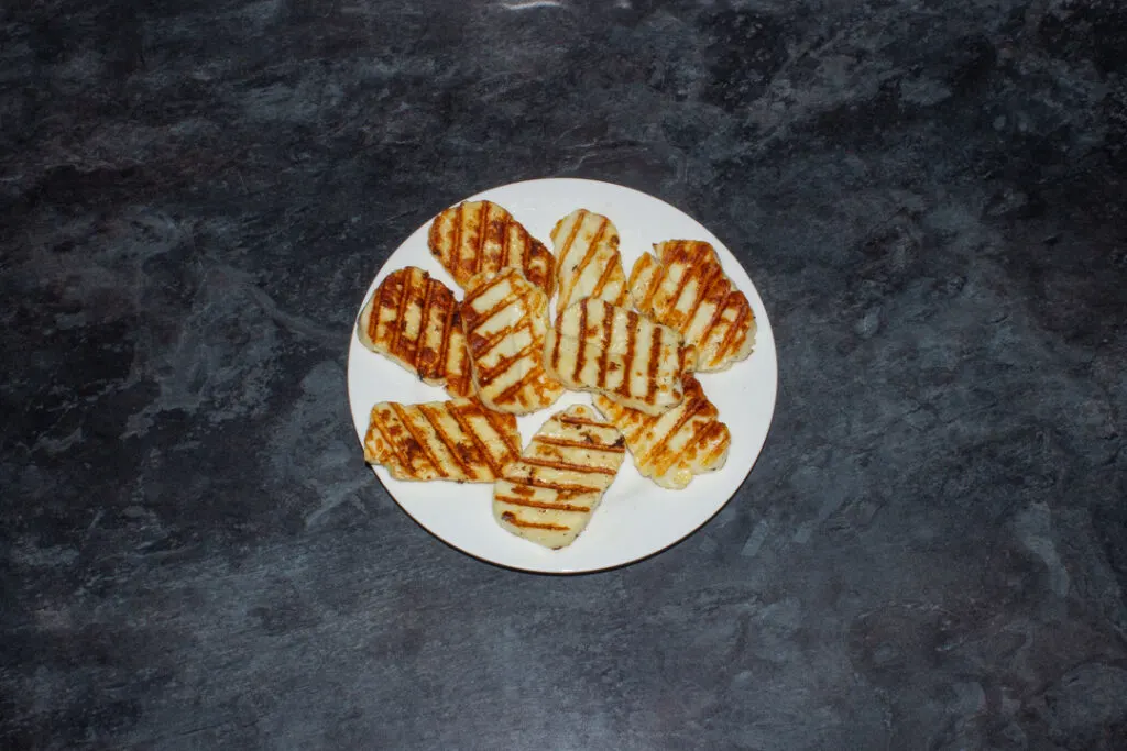 Grilled halloumi on a white plate