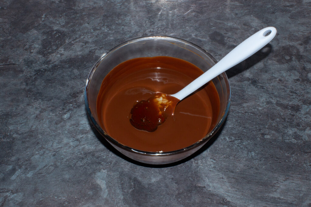 Melted butter and chocolate in a bowl with golden syrup