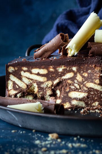Close up of a slice of chocolate biscuit cake