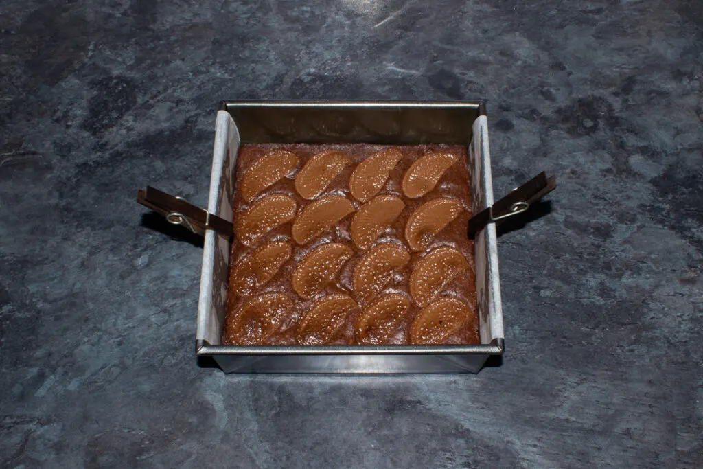 Baked chocolate orange brownies in a lined tin
