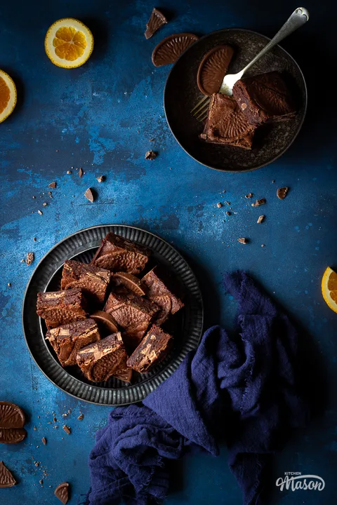 Chocolate orange brownies on a plate with a napkin