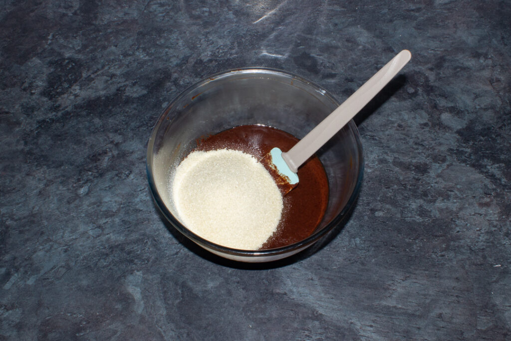 Melted butter, chocolate, egg and sugar in a mixing bowl