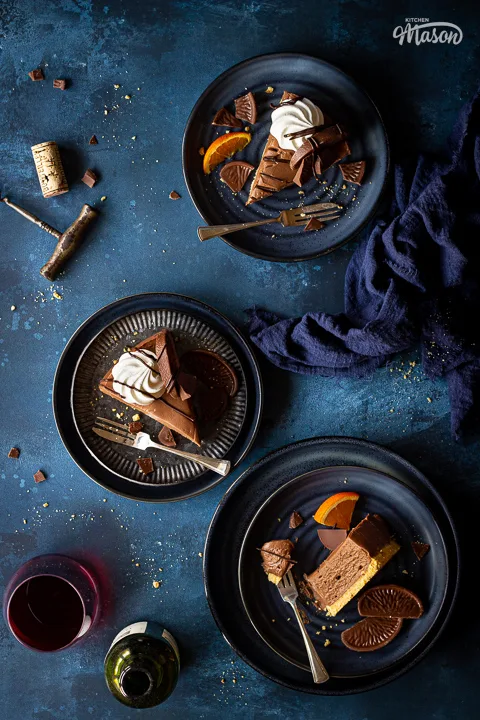 3 slices of no bake chocolate orange cheesecake on plates