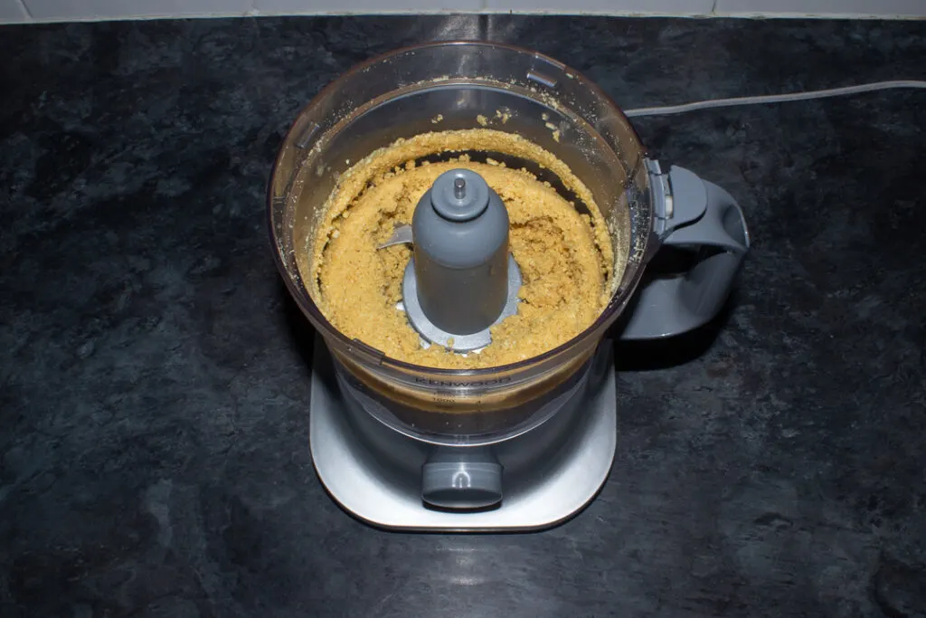 A cheesecake base in a food processor