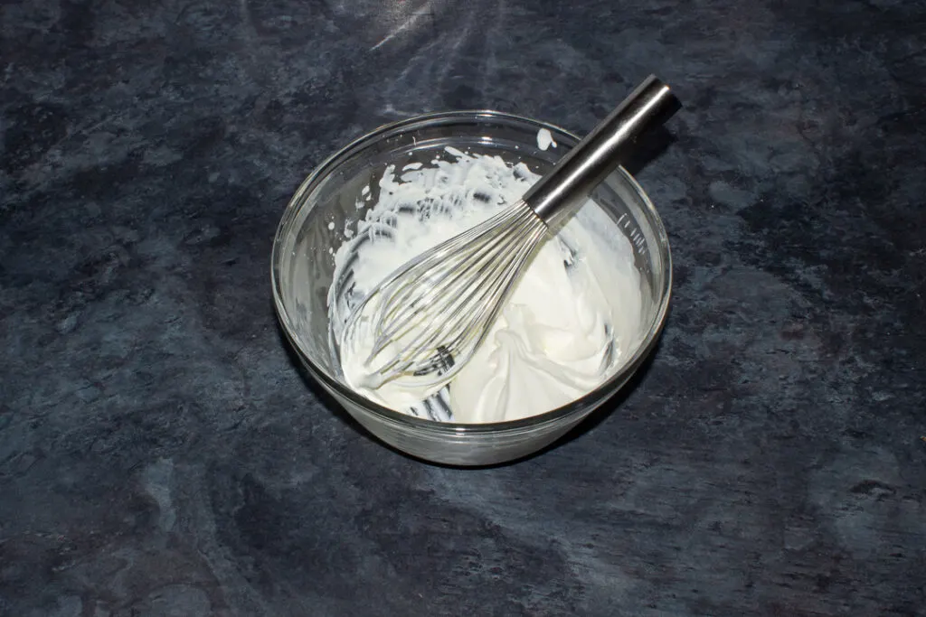 Whipped cream in a glass bowl
