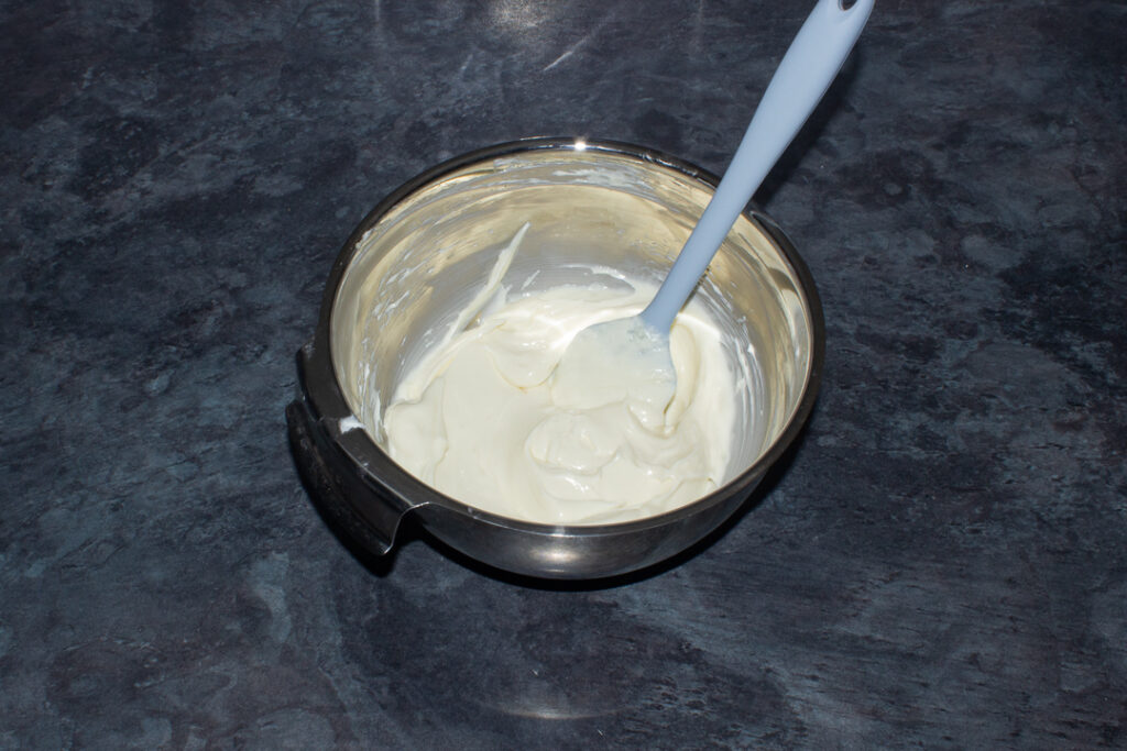 Cream cheese and sugar mixed together in a bowl