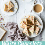 3 plates of white chocolate tiffin. A text overlay says White Chocolate Cranberry Tiffin.