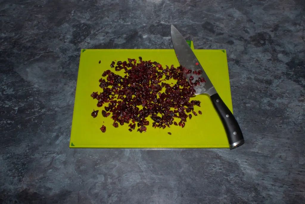 Chopped cranberries on a chopping board