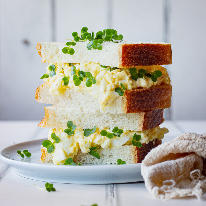 Egg mayo and cress sandwich stacked on a plate