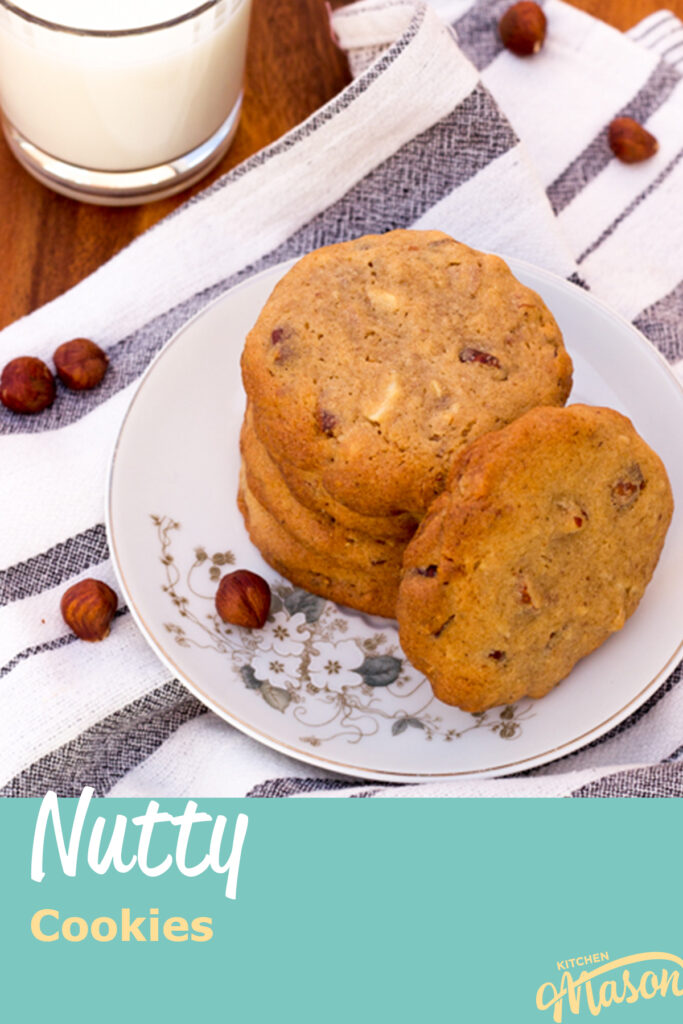 Nutty cookies on a plate with a glass of milk to the side. A text overlay says 'Nutty Cookies'
