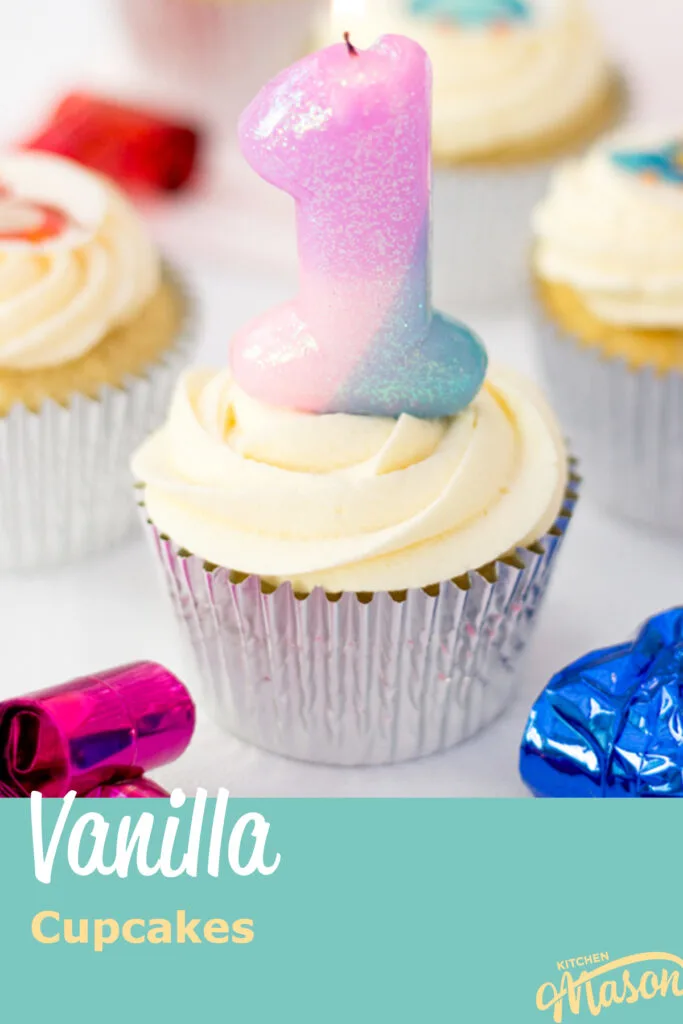 A vanilla cupcake in a silver foil case with a number 1 candle in the top