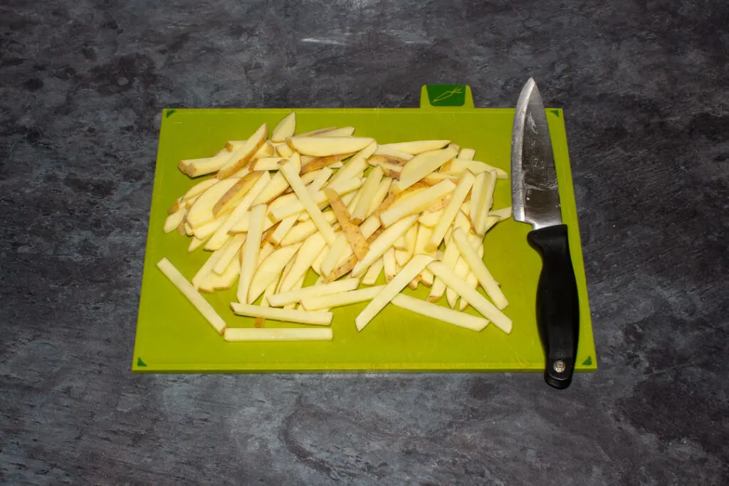 Cut fries on a chopping board