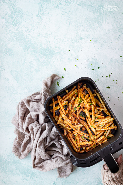 Cooked air fryer fries in a Ninja basket drawer