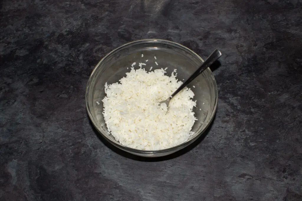 Cooked and cooled rice in a mixing bowl