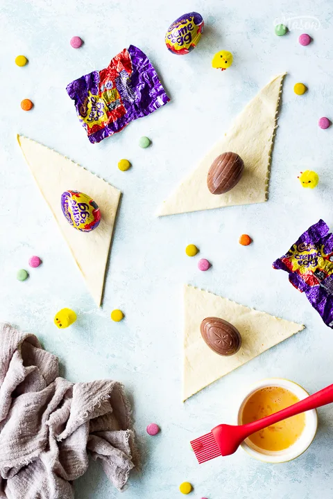 Creme Eggs on triangles of croissant dough