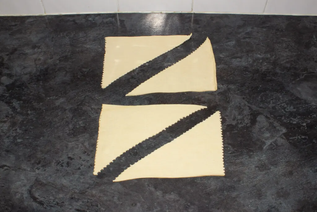 Croissant dough torn into large triangles