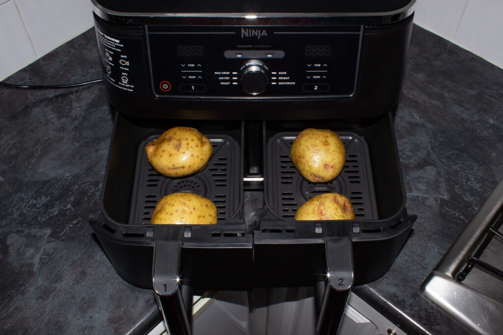 Oiled and salted potatoes in an air fryer
