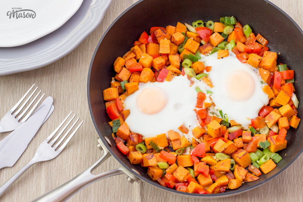 Sweet potato breakfast has with eggs in a pan