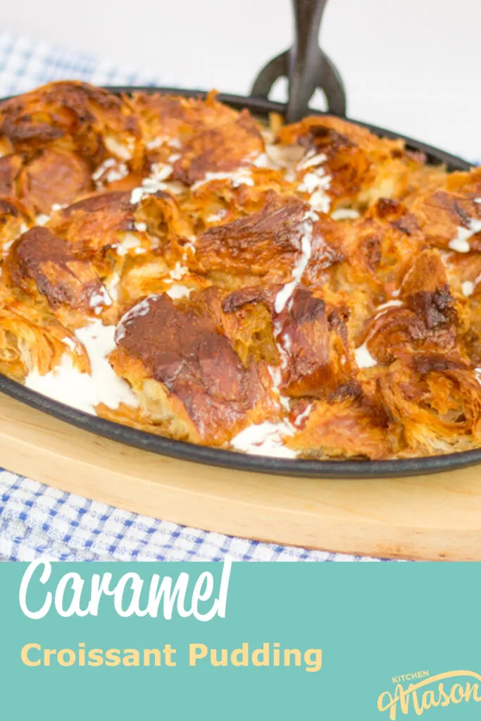 Close up of caramel croissant pudding in a cast iron pan. A text overlay says 'caramel croissant pudding'.