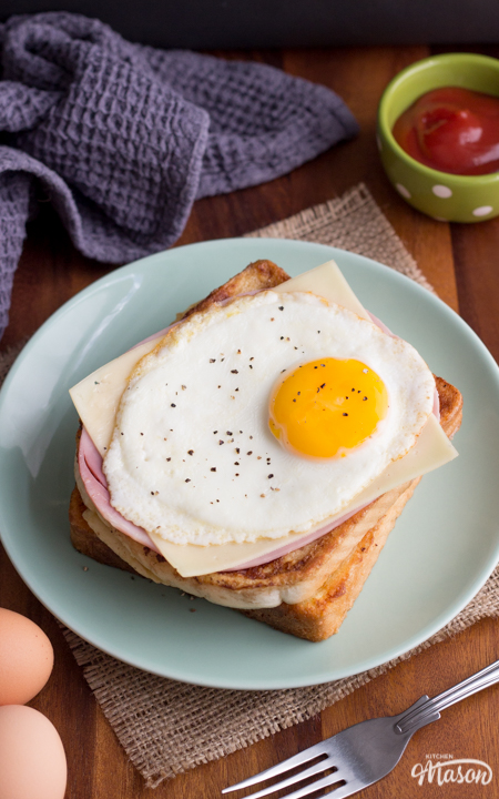 Ham egg and cheese savoury French toast on a plate with a fork