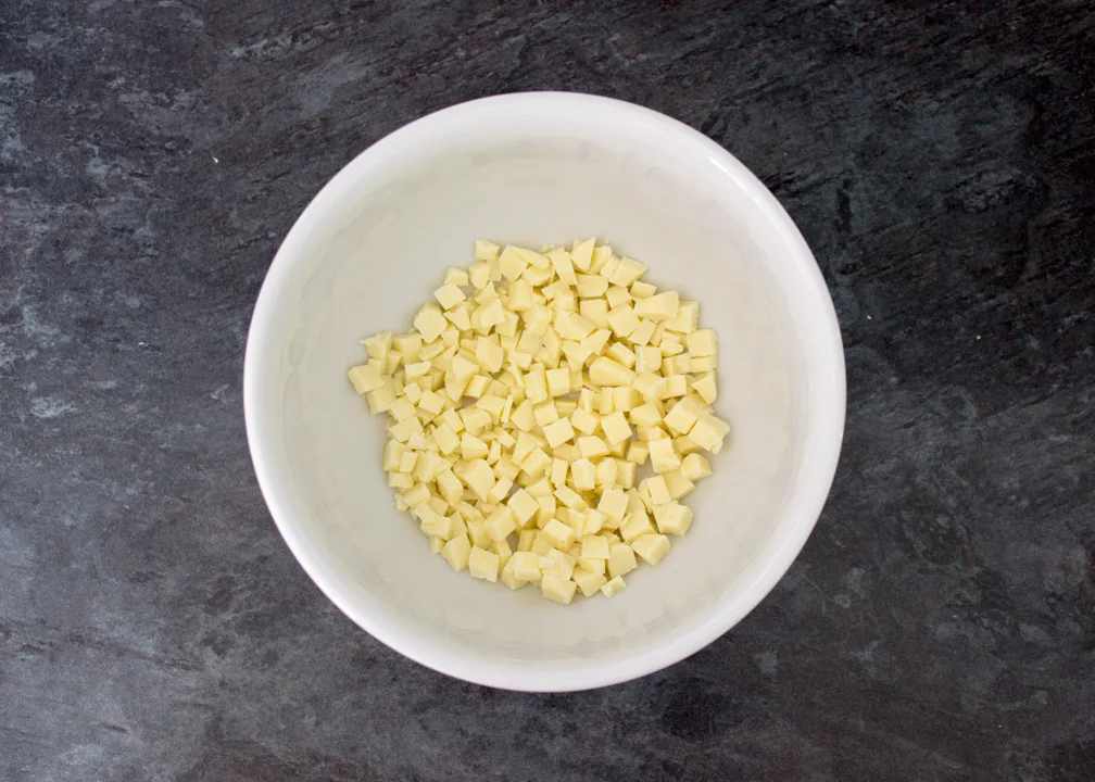 Chopped white chocolate in a bowl