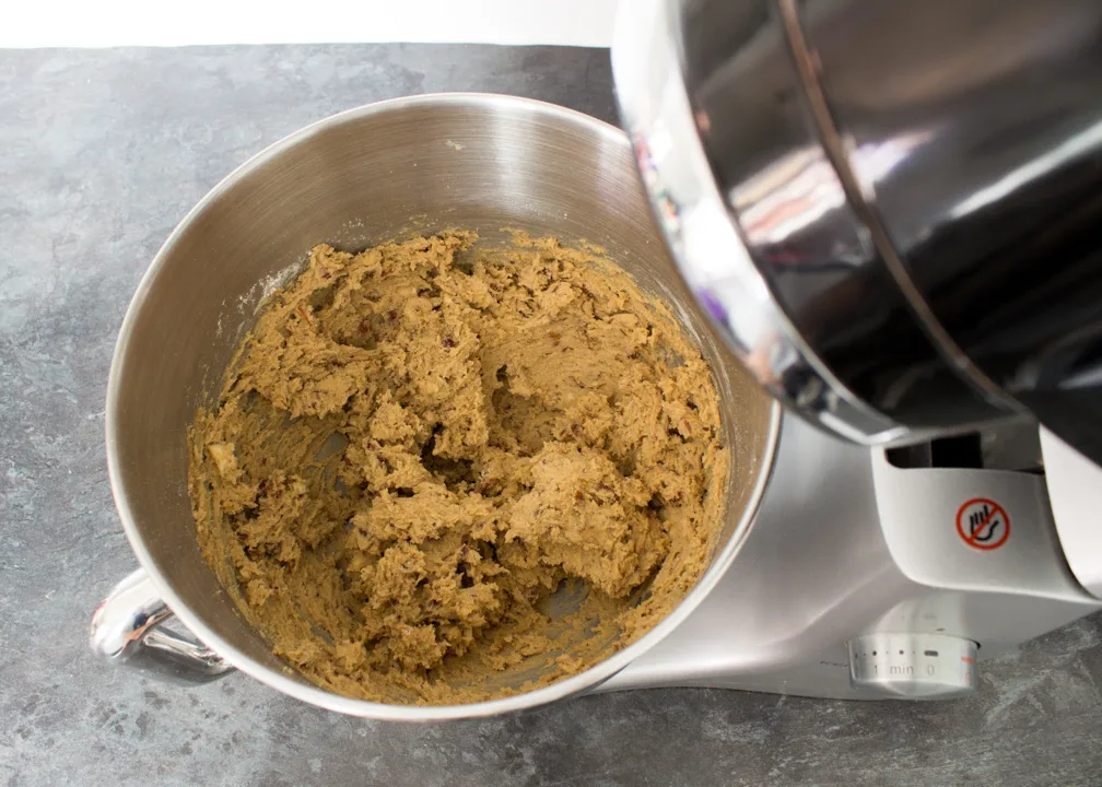 Nutty cookie dough in a stand mixer bowl