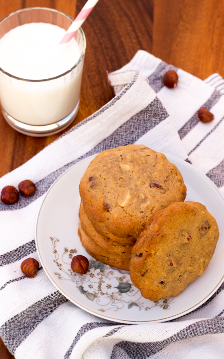 A stack of nutty cookies on a plate